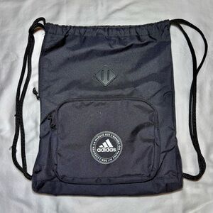 Adidas Black Drawstring Backpack with side zipper pocket and front zipper pouch.